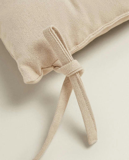 QUILTED CHAIR CUSHION WITH TIES