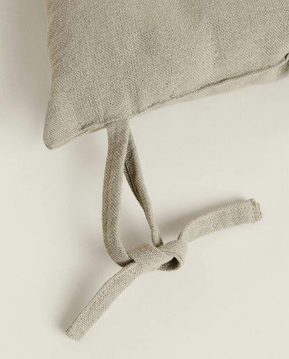 QUILTED CHAIR CUSHION WITH TIES